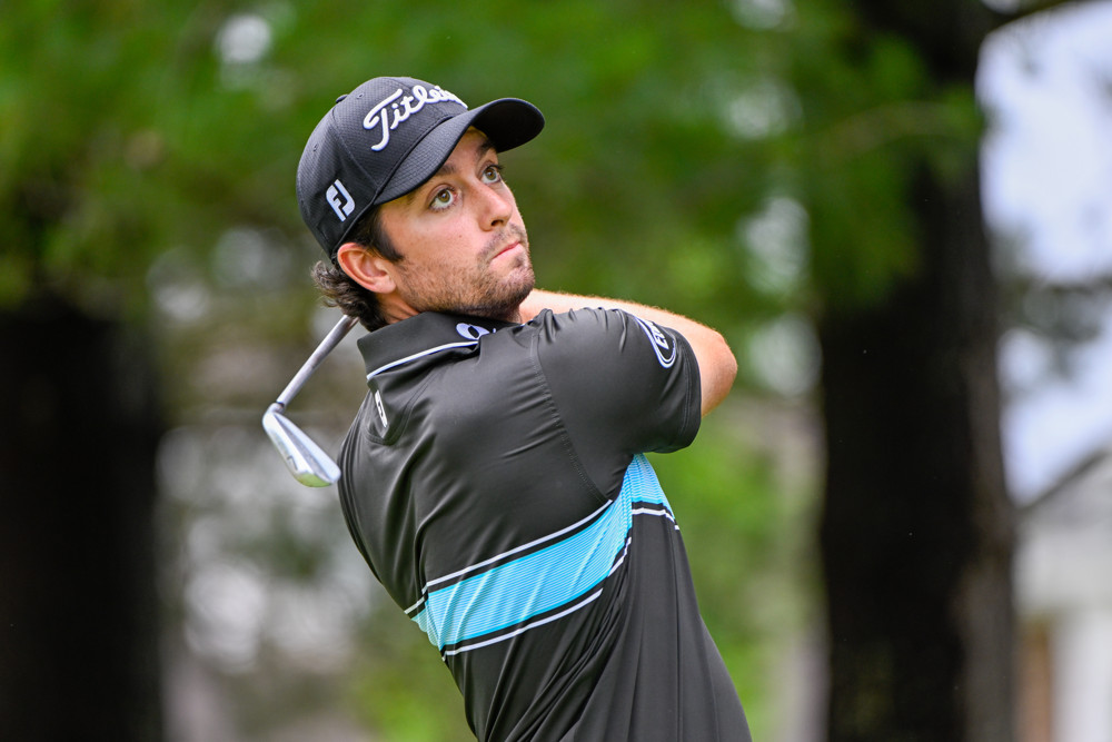Golfer focused on an iron shot illustrating decision making and course management in golf